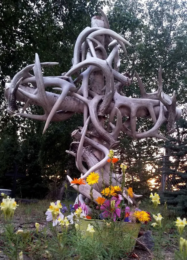 Antler cross headstone with flowers
